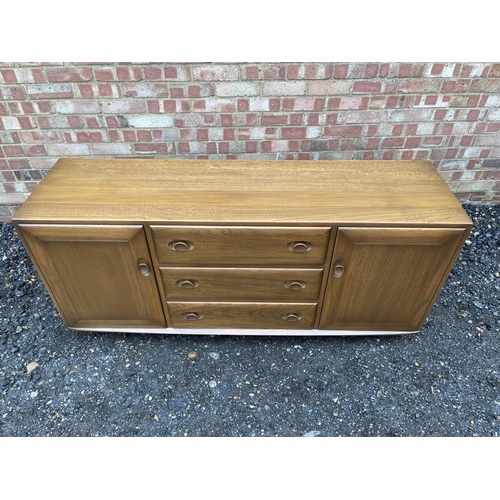 84 - A mid century ercol golden dawn sideboard 140x44x70