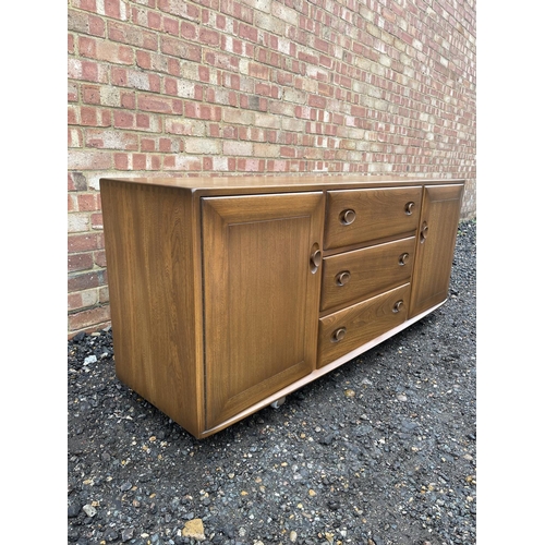 84 - A mid century ercol golden dawn sideboard 140x44x70