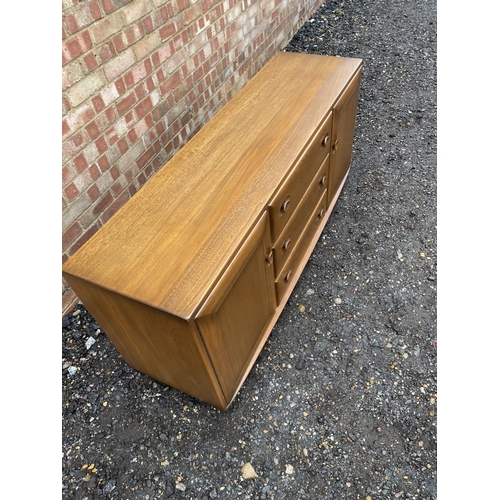 84 - A mid century ercol golden dawn sideboard 140x44x70