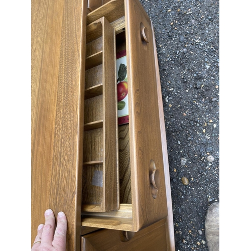 84 - A mid century ercol golden dawn sideboard 140x44x70