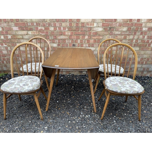 85 - An ercol golden dawn drop leaf table together with four ercol stick-back chairs