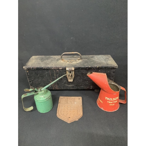 850 - Old wooden box, two vintage oil cans and cast iron plaque