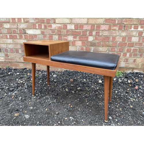 87 - A retro teak hall seat