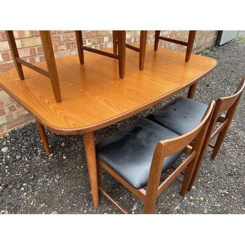 90 - A mid century g plan teak extending dining table together with four chairs by BATH CABINET MAKERS 15... 