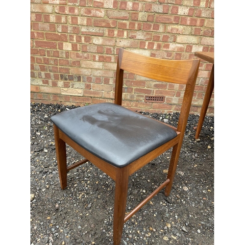 90 - A mid century g plan teak extending dining table together with four chairs by BATH CABINET MAKERS 15... 