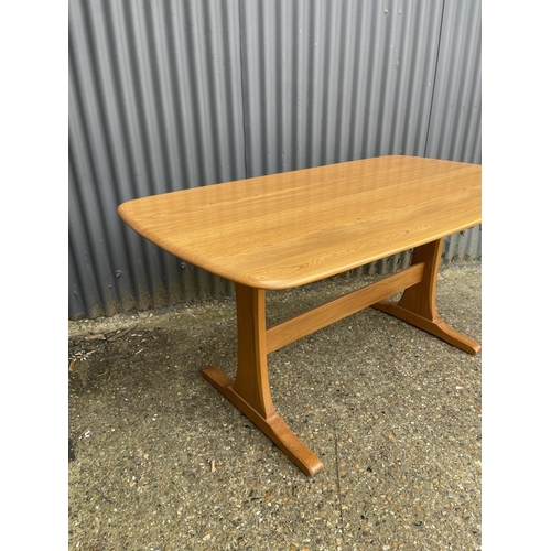 217 - An Ercol light elm refectory dining table 154x84x77