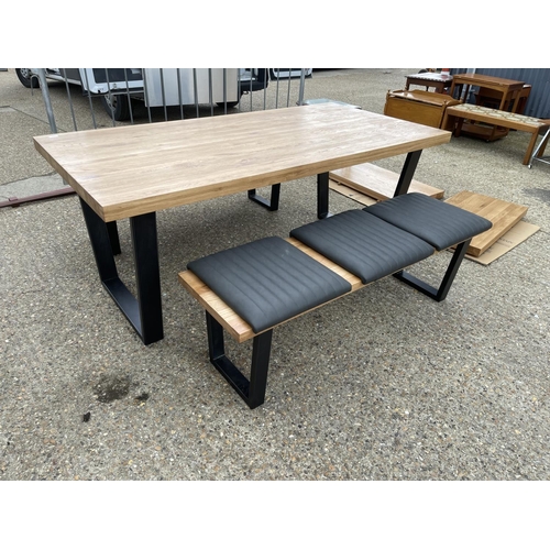 10 - A modern light oak refectory style dining table together with two bench seats with pads plus two ext... 