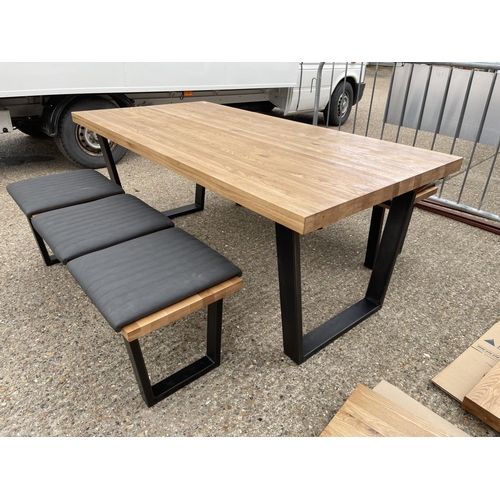 10 - A modern light oak refectory style dining table together with two bench seats with pads plus two ext... 