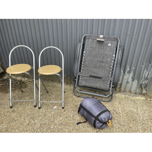 105 - Two folding stools, fishing chair and sleeping bag