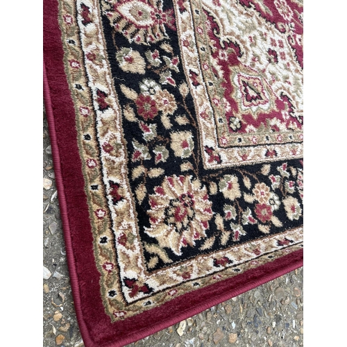 106 - A red pattern rug 160x 289