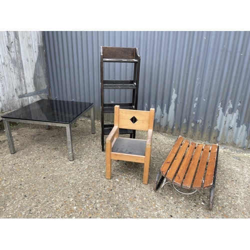 107 - Small oak bookcase, child chair, glass top table, sledge