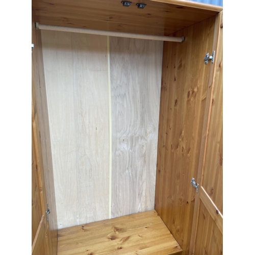 116 - A pine double wardrobe 90x50x187