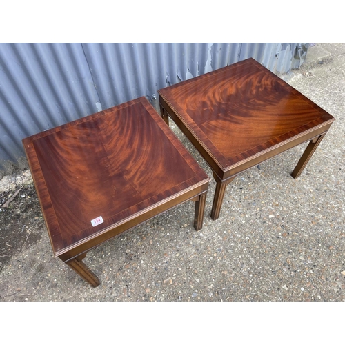 134 - A pair of reproduction mahogany lamp tables