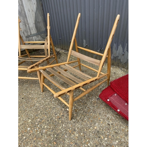 141 - A pair of ercol 427 chairs for re upholstery