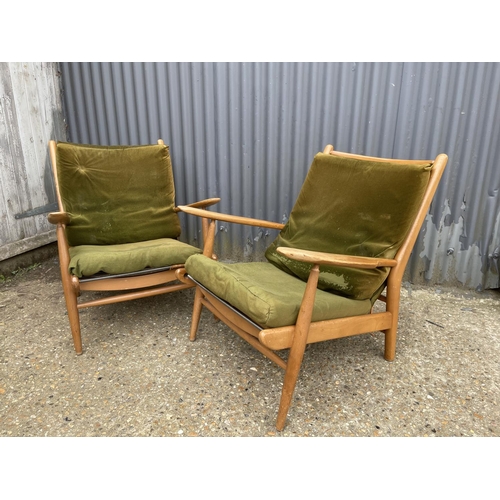 142 - A pair of mid century teak framed lounger chairs by Scandart