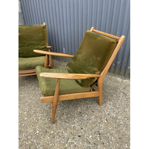 142 - A pair of mid century teak framed lounger chairs by Scandart