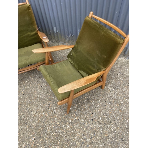 142 - A pair of mid century teak framed lounger chairs by Scandart