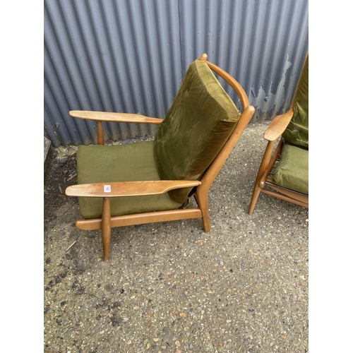 142 - A pair of mid century teak framed lounger chairs by Scandart