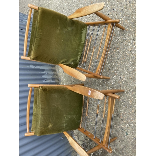 142 - A pair of mid century teak framed lounger chairs by Scandart