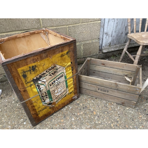 145 - A tea chest, fruit crate, painted chair and a stool