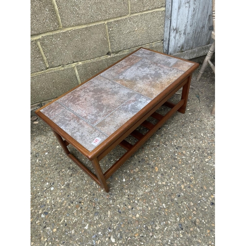 146 - A teak tile top coffee table