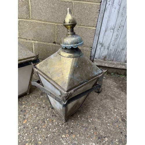 148 - A pair of large brass lantern light fittings with aluminium arm fittings