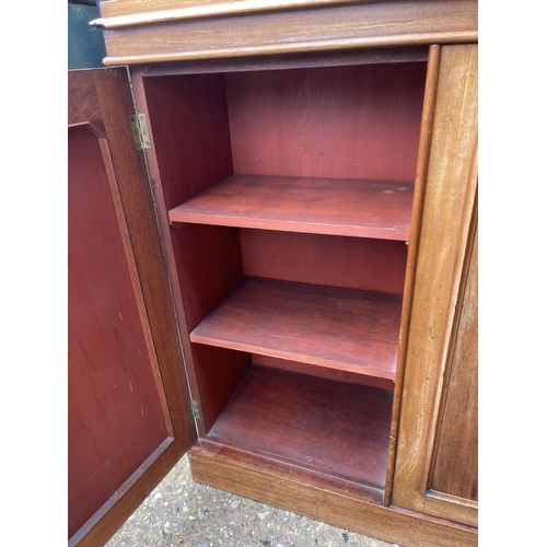 149 - A Victorian mahogany three door chiffonier with gallery back 124cm wide