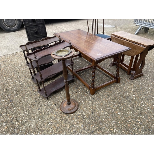 165 - Oak coffee table, chair, drop-leaf table, carved chest, two wall racks and an ash stand