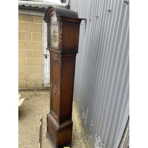 192 - A Tempus Fugit oak cased longcase clock with three weights and pendulum