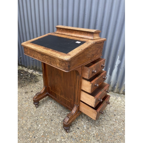 21 - A victorian walnut davenport with four drawers to one side and four dummy drawers, black leather top... 