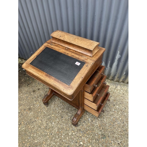 21 - A victorian walnut davenport with four drawers to one side and four dummy drawers, black leather top... 