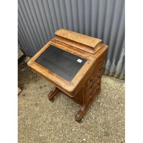 21 - A victorian walnut davenport with four drawers to one side and four dummy drawers, black leather top... 