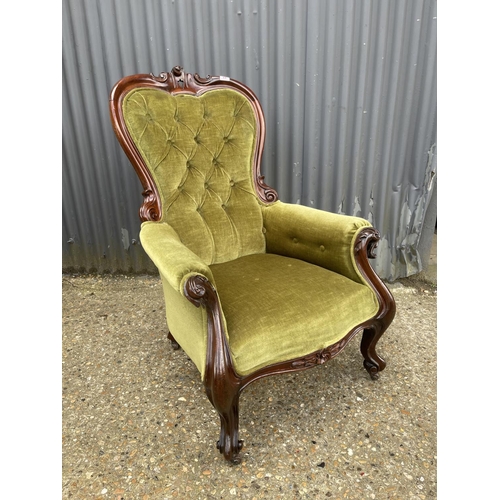 22 - A victorian green upholstered button back nursing chair