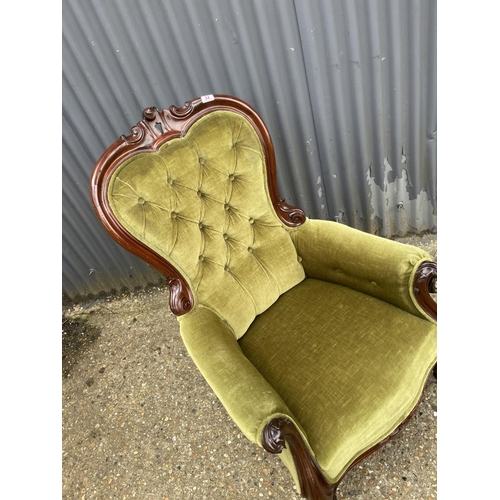 22 - A victorian green upholstered button back nursing chair