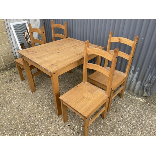 226 - A modern square pine table together with four chairs