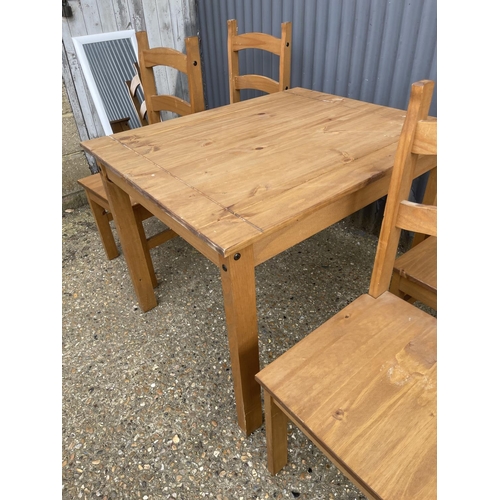 226 - A modern square pine table together with four chairs