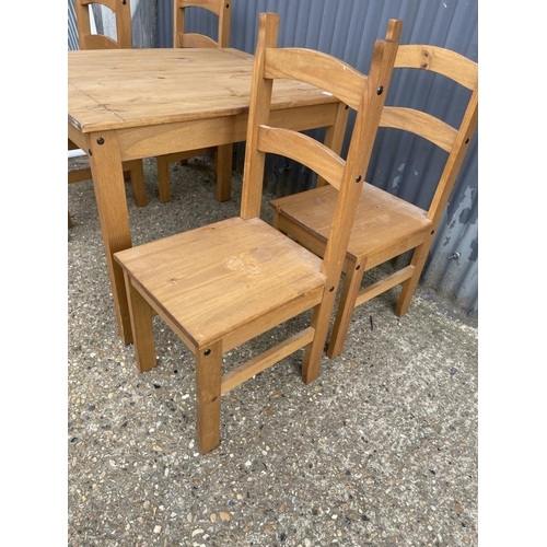 226 - A modern square pine table together with four chairs