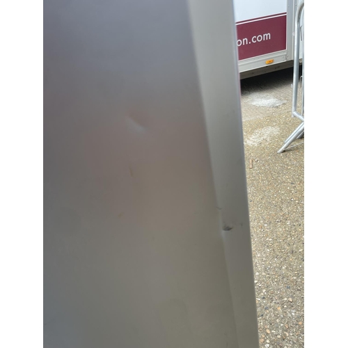 228 - A beko upright fridge (dent to door)