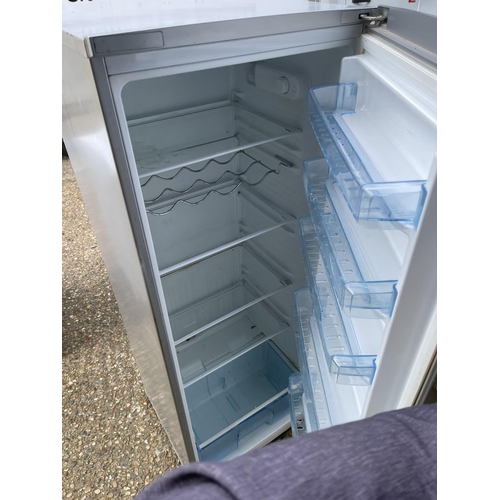 228 - A beko upright fridge (dent to door)