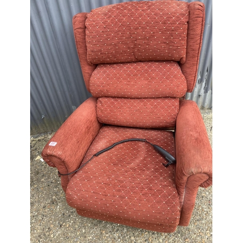 237 - A red upholstered electric rise and recline armchair