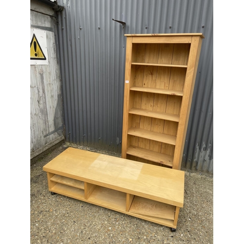 241 - A tall modern pine bookcase together with an ikea media stand / coffee table