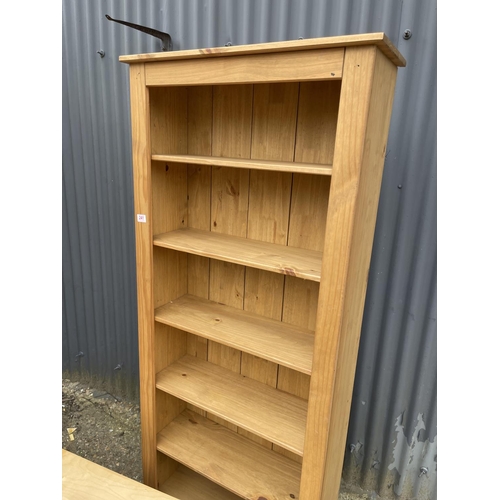 241 - A tall modern pine bookcase together with an ikea media stand / coffee table