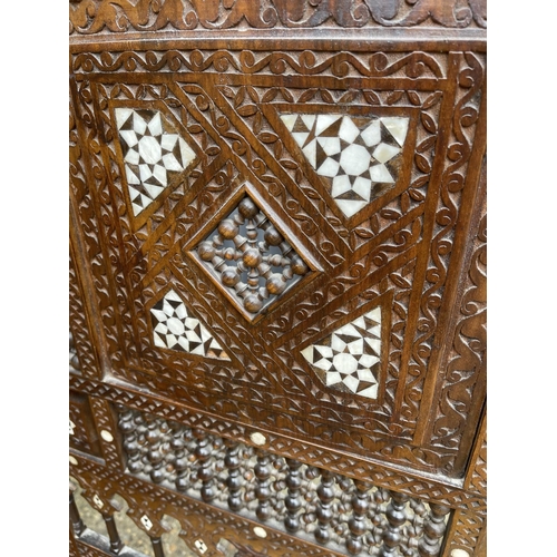 242 - An Islamic style carved and inlaid three section folding screen 184cm tall