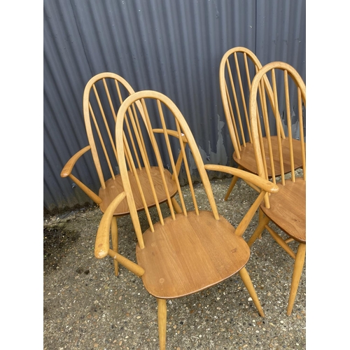 26 - A set of four ercol stick back dining chairs (inc 2 carvers)