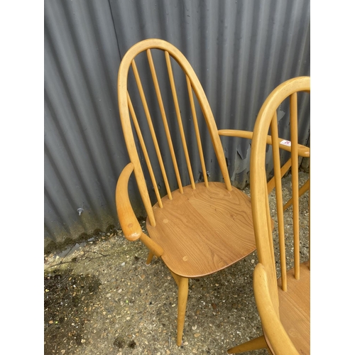 26 - A set of four ercol stick back dining chairs (inc 2 carvers)