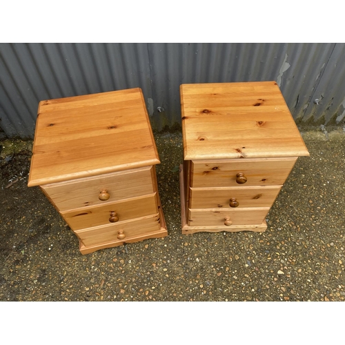 261 - A pair of pine bedside chests of three