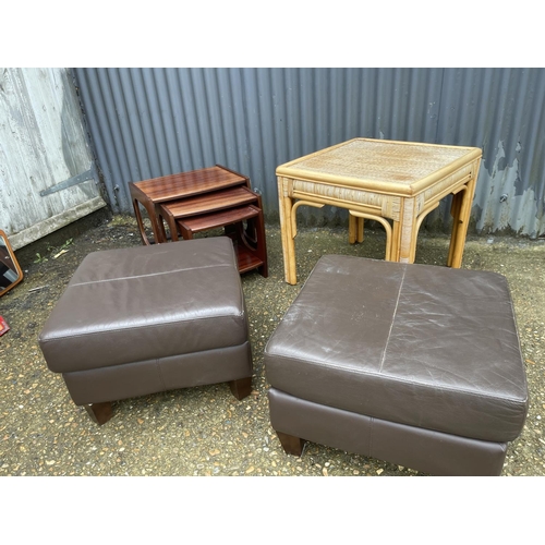 264 - A bamboo table, nest of three and two leather footstools