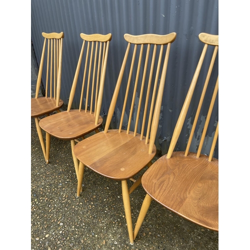 266 - A set of four ercol light elm stick back dining chairs