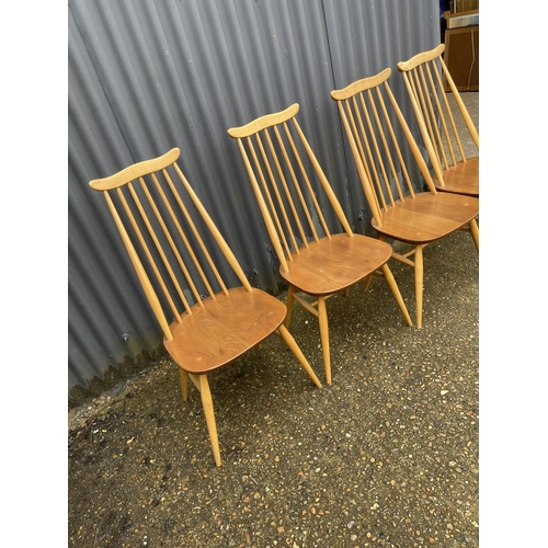 266 - A set of four ercol light elm stick back dining chairs