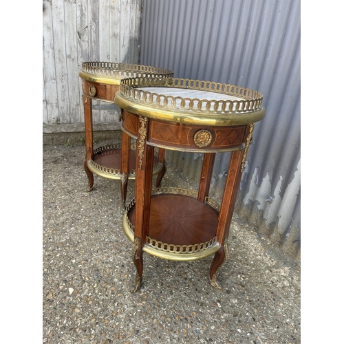 294 - A pair of French gueridon inlaid circular single drawer side tables with brass mounts, brass gallery... 